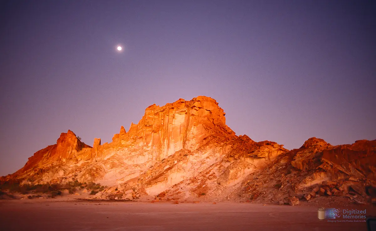 photo ofsunset at rainbow valley/Australia with moon